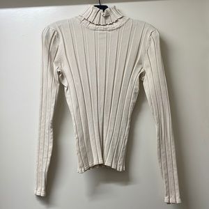 Cream ribbed turtleneck. Super soft and in like new condition.